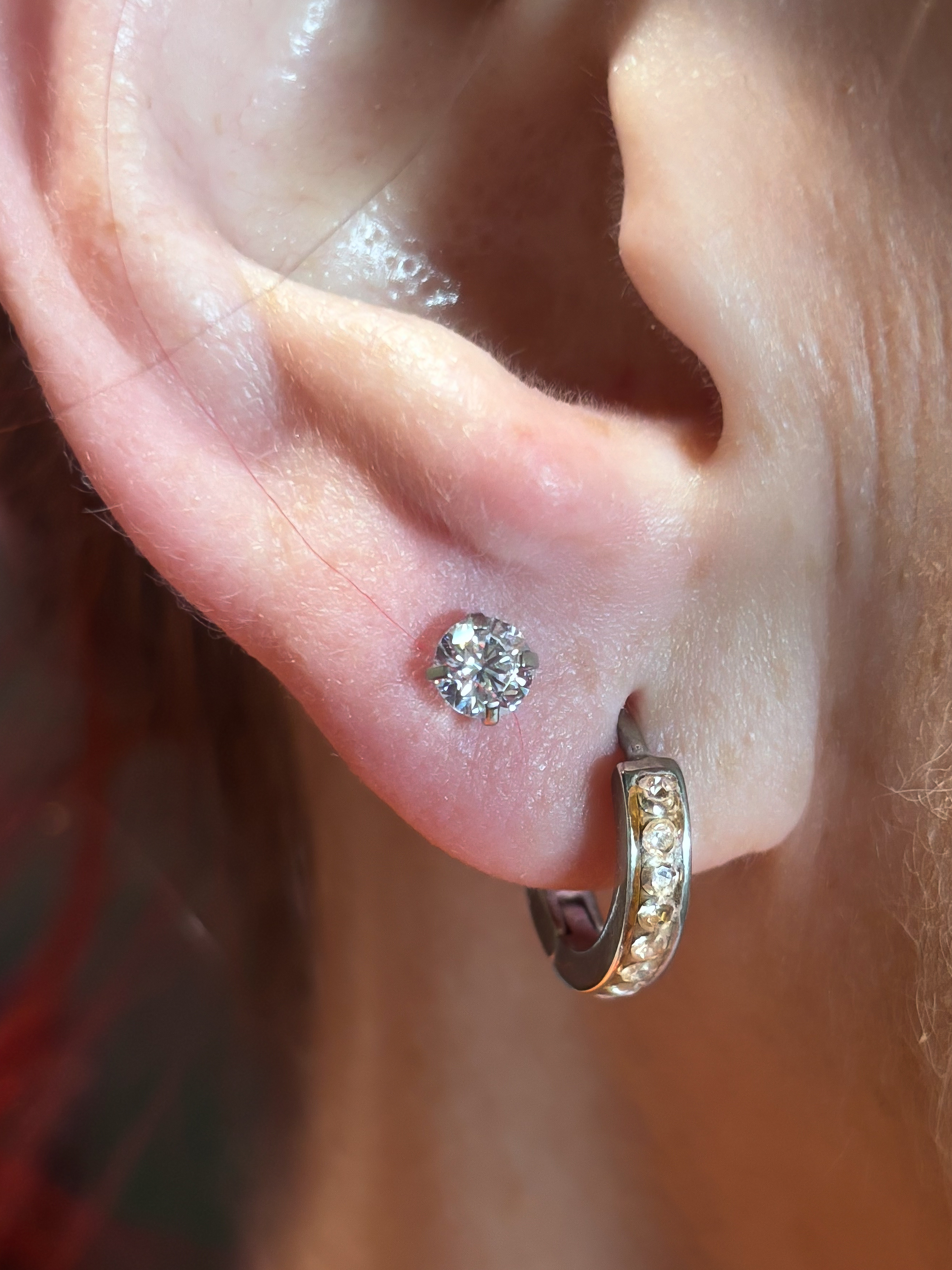 Upper lobe ear piercing with gold titanium jewelry