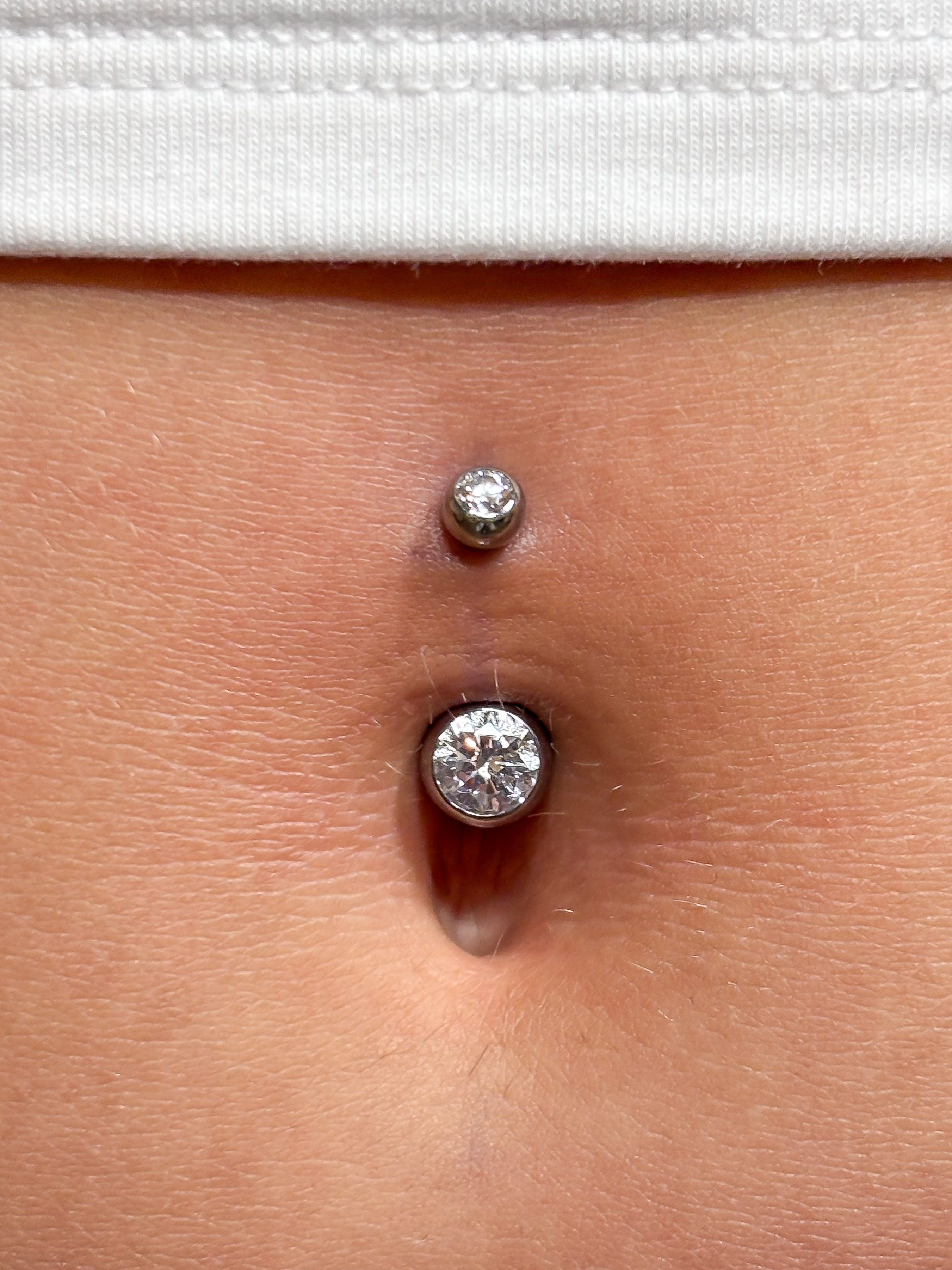 Belly button piercing with fine jewelry