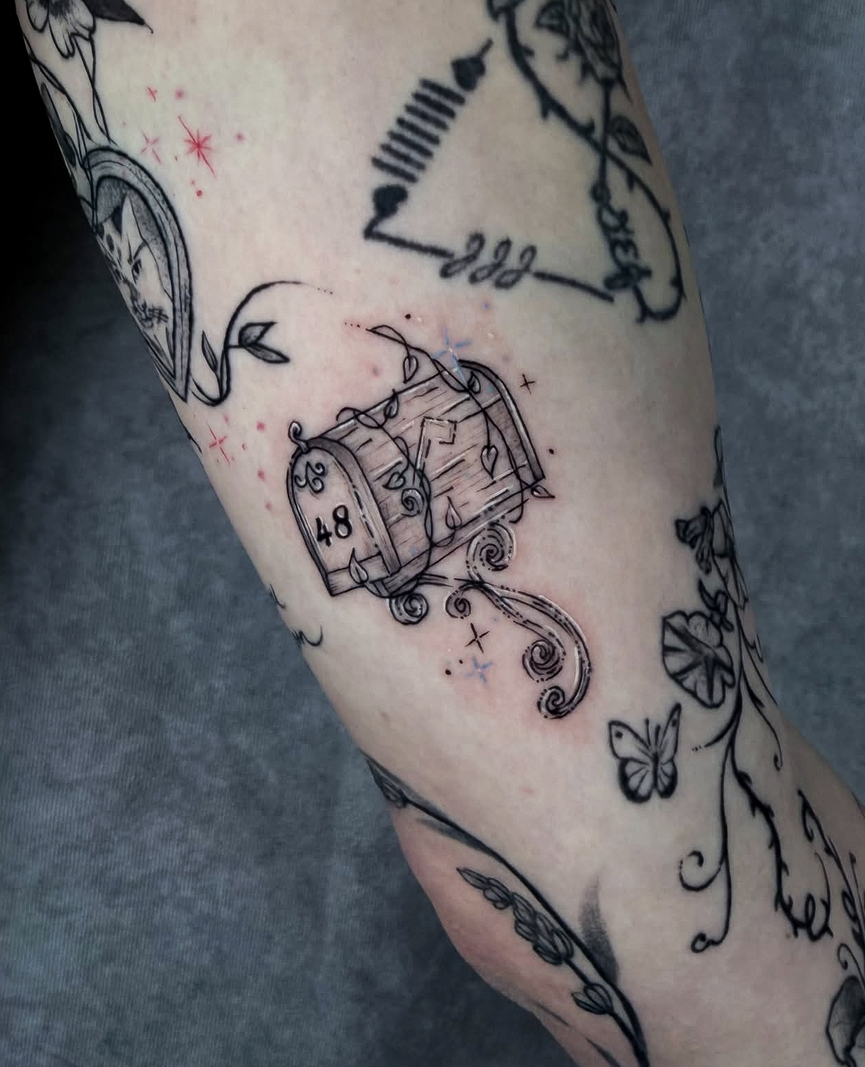 Fine line illustrative tattoo by Addison Powell at Diroka Tattoo Studio