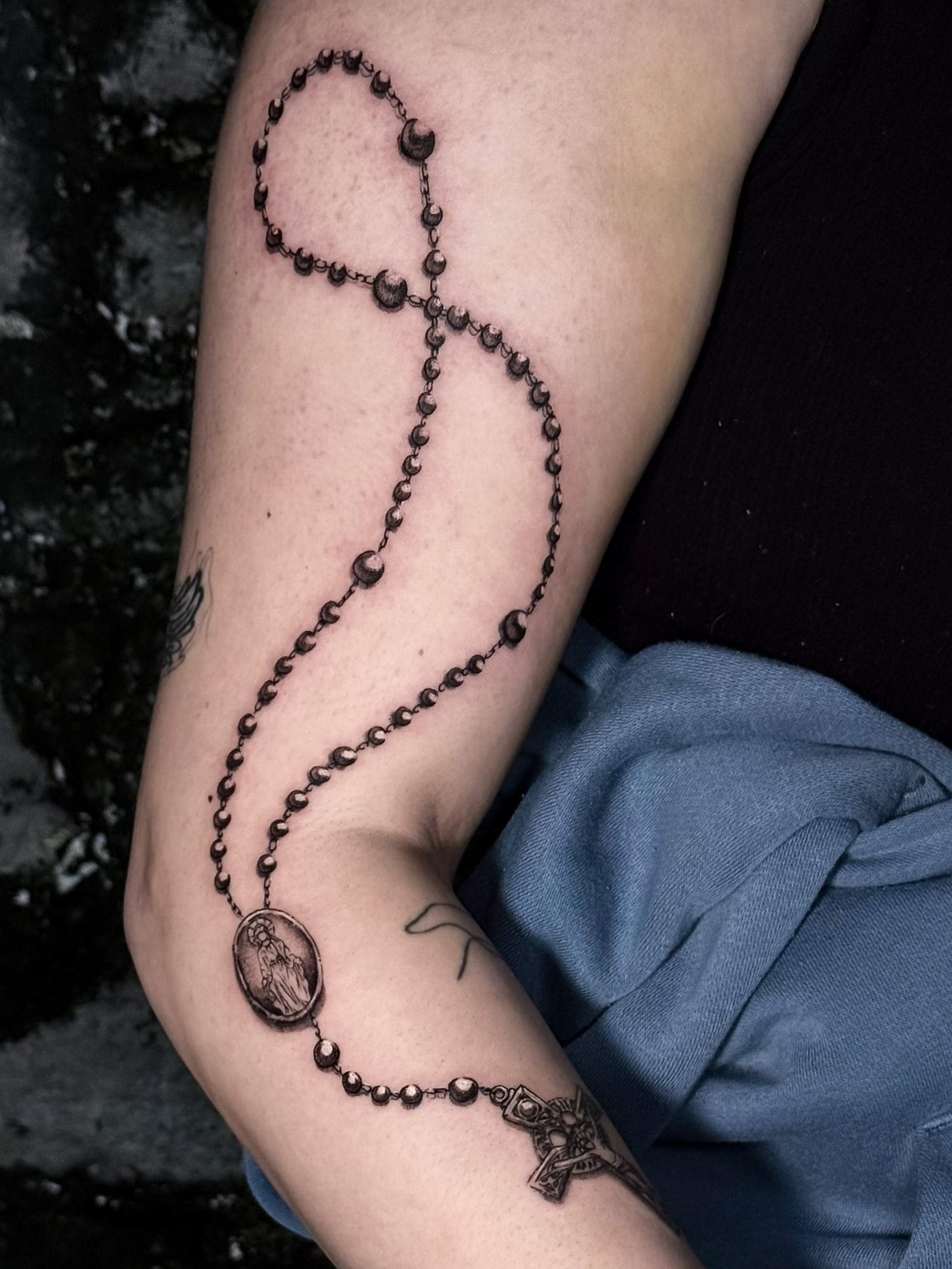 Fine line floral tattoo by Addison Powell at Diroka Tattoo Studio