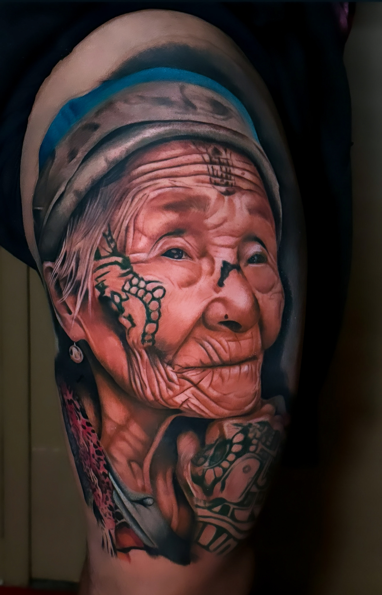 Color realism portrait tattoo by Arnold Camargo at Diroka Tattoo Studio