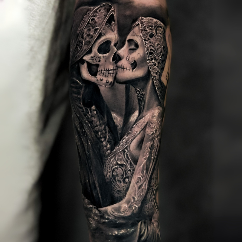 Black & Grey realism depicting a skeletal bride and groom in a timeless kiss