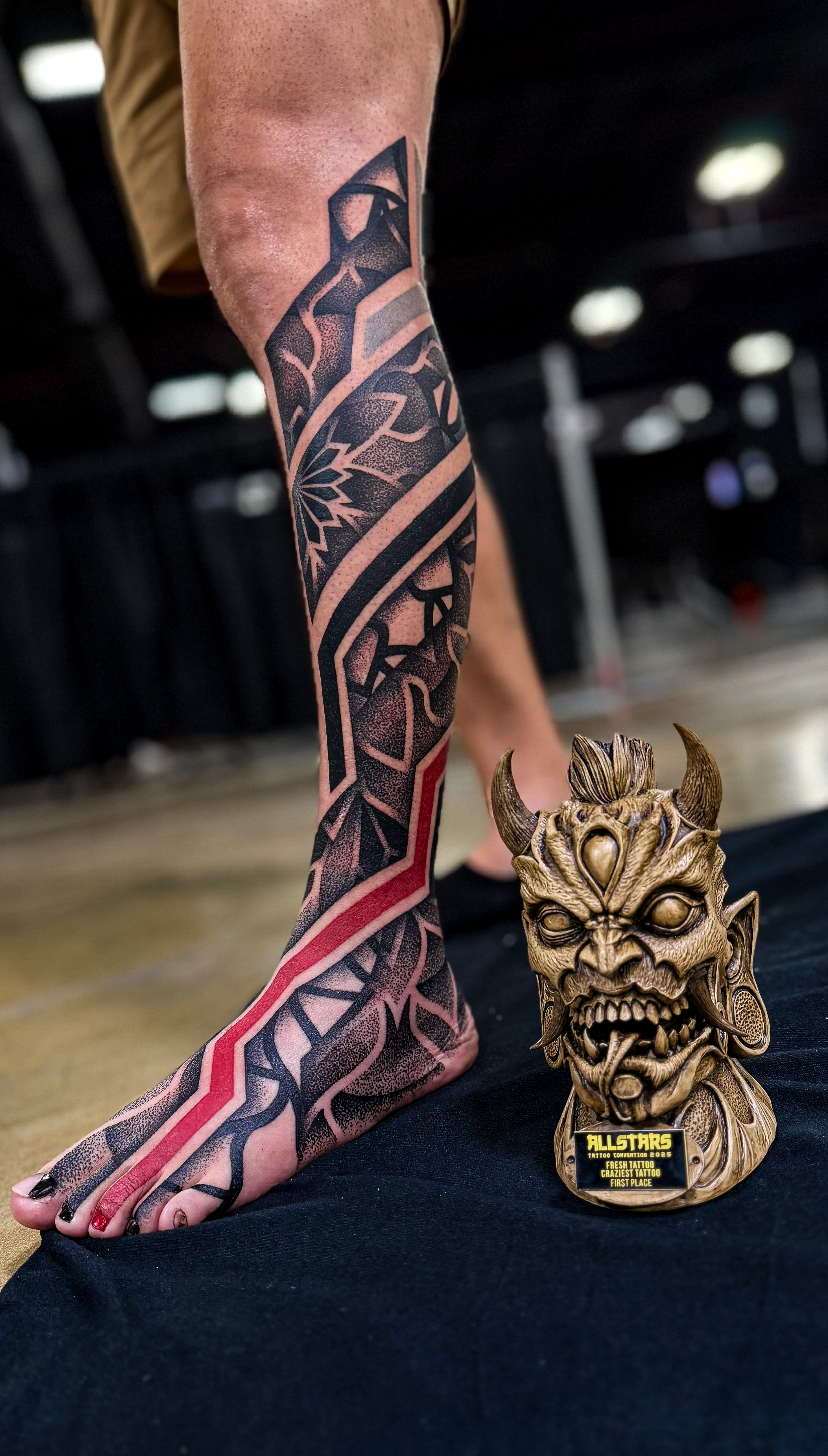 Geometric leg tattoo by Diego Juarez at Diroka Tattoo Studio