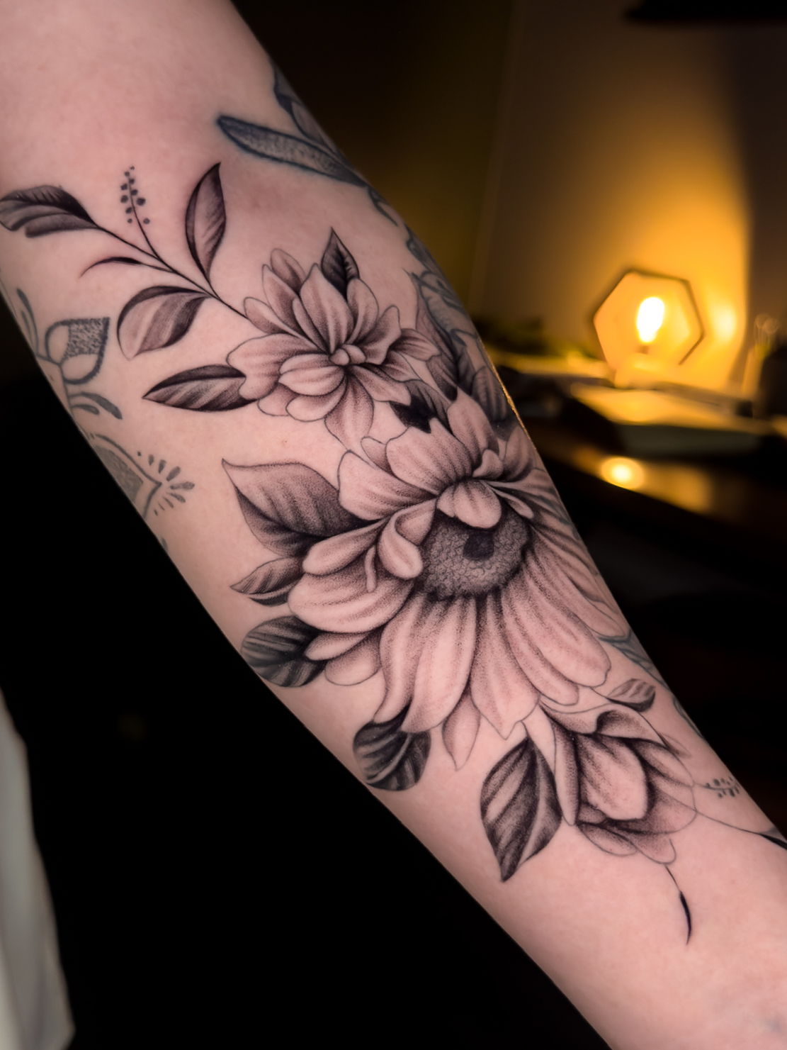 Botanical fine line tattoo by Julian Carvajal at Diroka Tattoo Studio